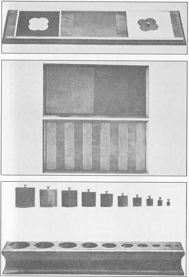 (A) DRAWING TABLE AND INSET. (B) WOODEN TABLETS. These are
partly covered with sandpaper to give rough and smooth surfaces.  (C) SOLID INSETS.
With these the child, working by himself, learns to differentiate objects according
to thickness, height, and size.